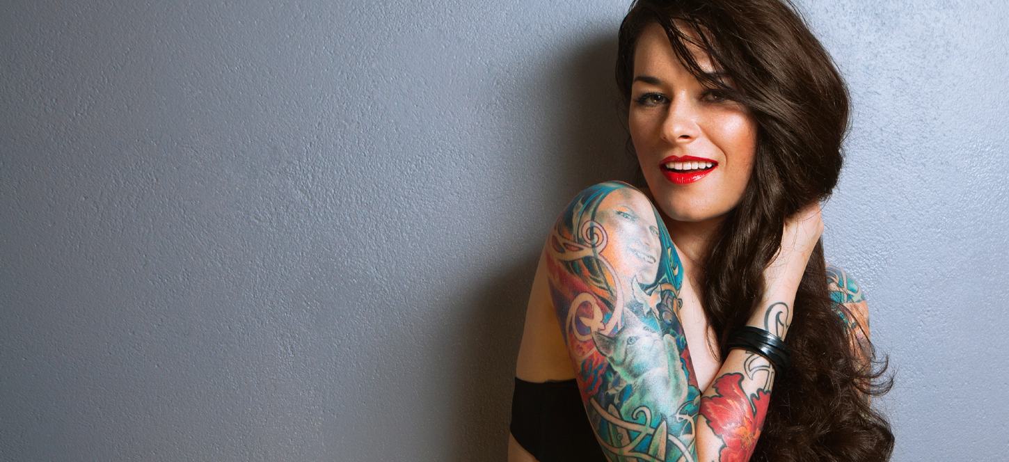 Woman with sleeve tattoos | Victorian Cosmetic Dermal Clinics